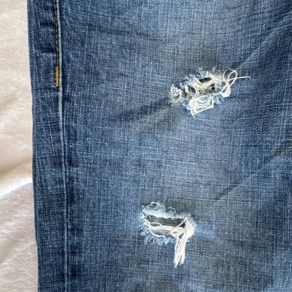 True Religion distressed blue jeans